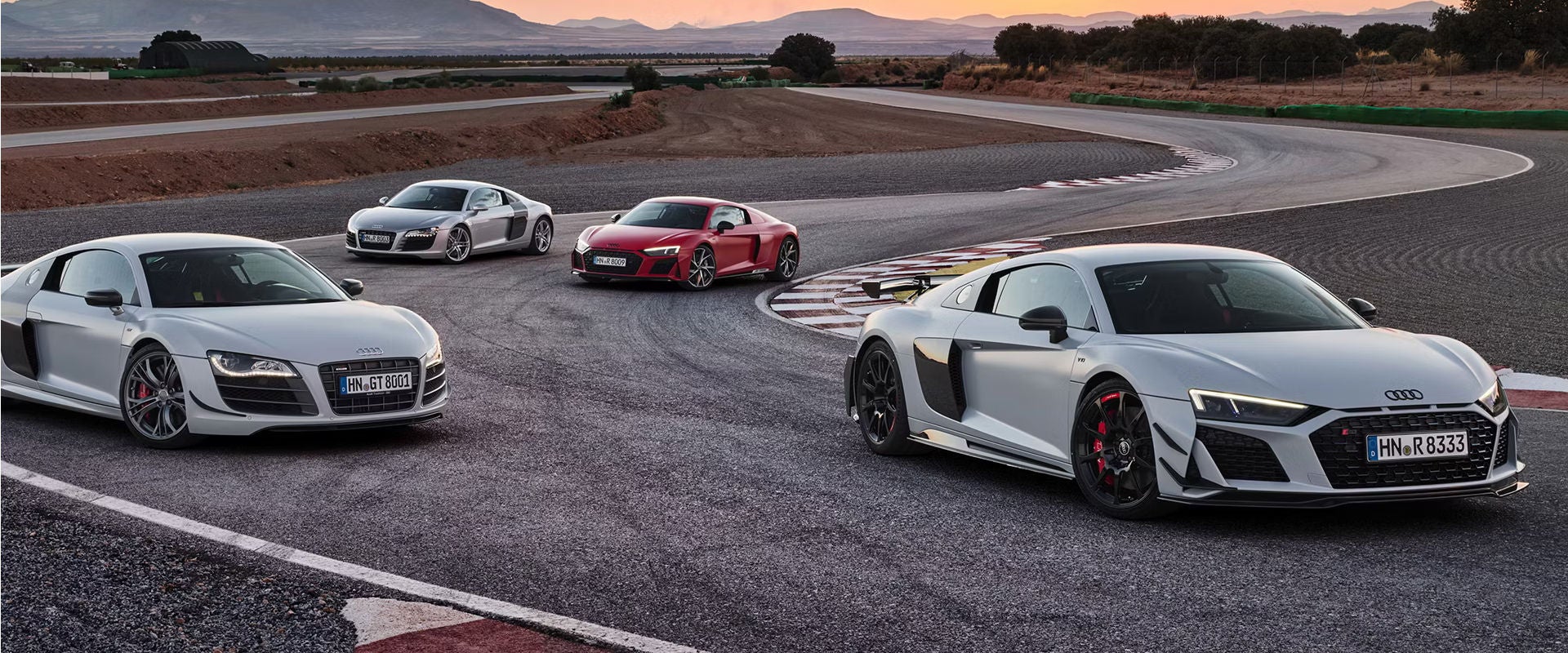 Image of Audi race cars racing on a track