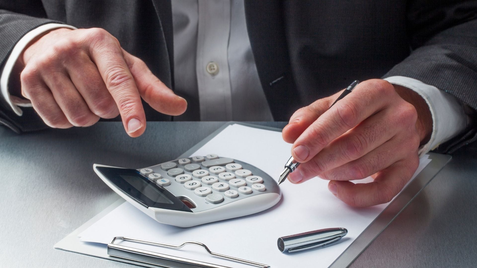 image of male doing calculations for pricing