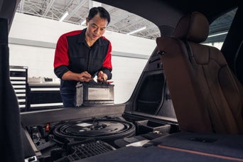 Service technician servicing tire.