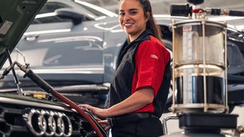 Service technician inspecting a vehicle