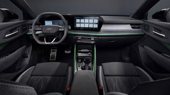 Interior of the 2026 Audi Q3 from the backseat view.