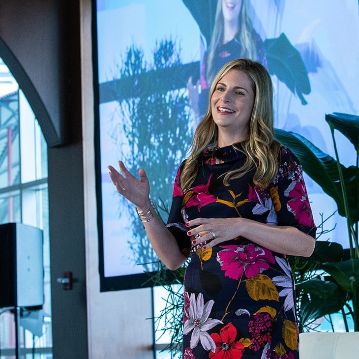 A female STEM leader presenting. 