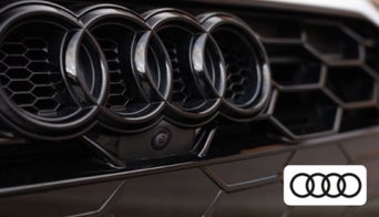 Driver enjoying Audi Adobe Audio with immersive sound inside an Audi vehicle 