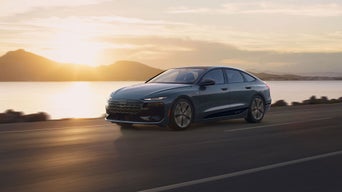 Three-quarter side view of the Audi A6 Sportback e-tron in motion.