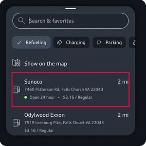 A search bar occupies the top of the screen while the destination details are highlighted at the bottom.