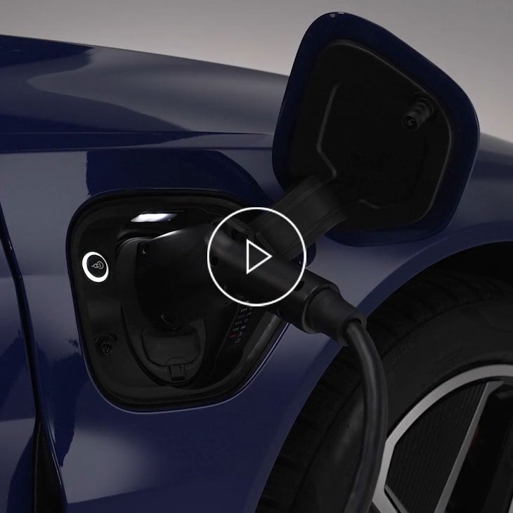  Close-up on an Audi vehicle charging. 