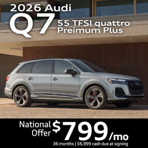 Side view of an Audi Q7 driving.