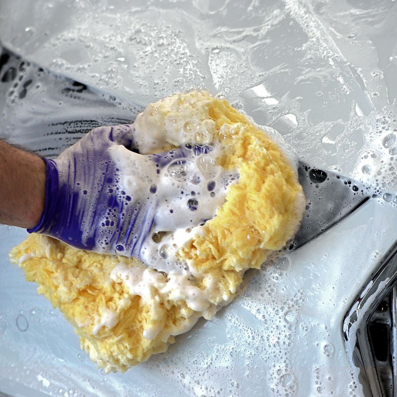 image of a headlight being washed
