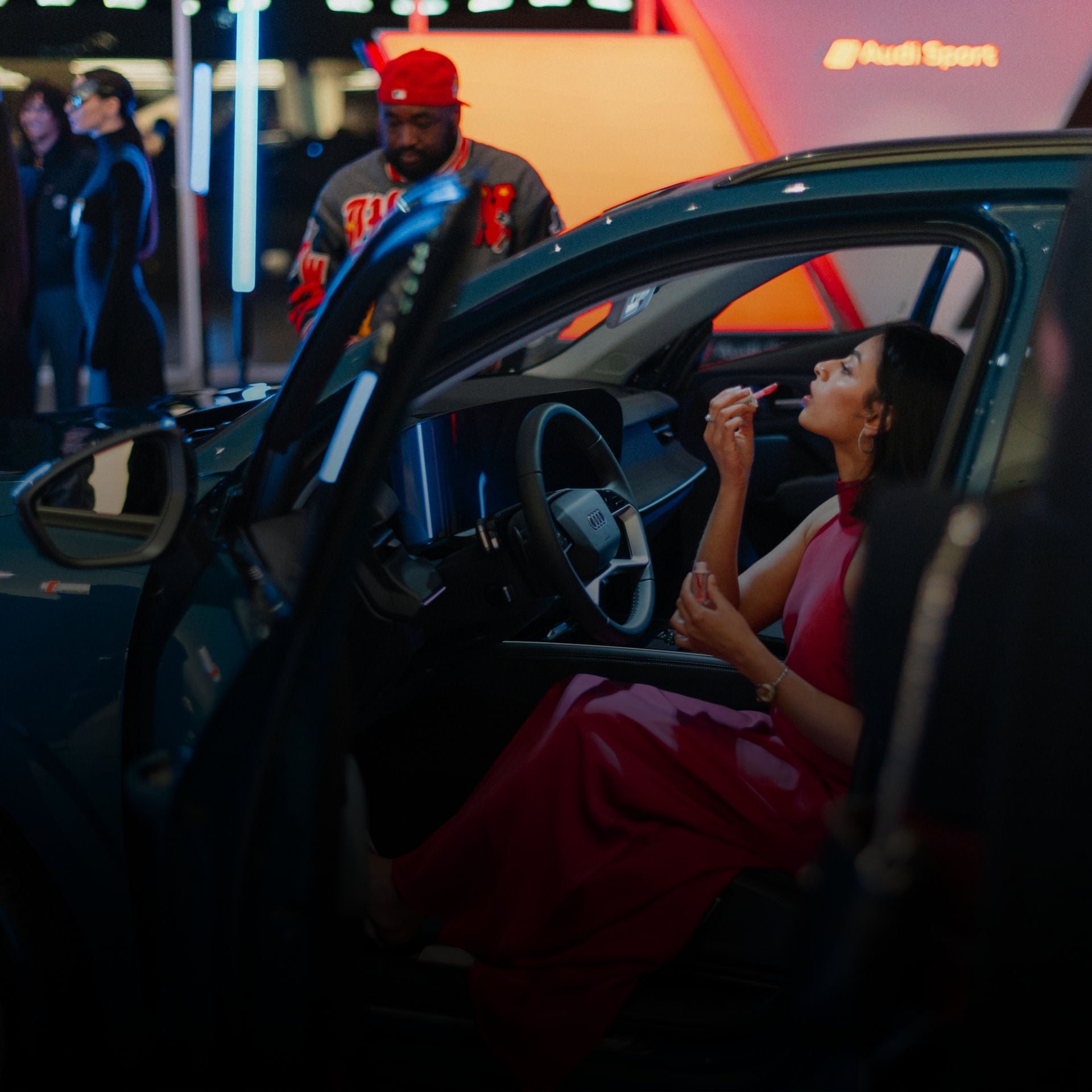 Front view of a white Audi SUV parked on the side of a street. 