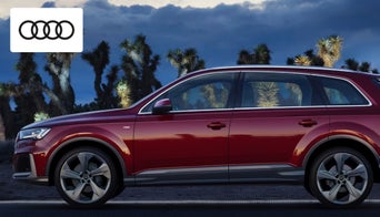 2025 Audi Q7 luxury SUV parked outside Audi Dayton, highlighting its bold front grille and sleek design