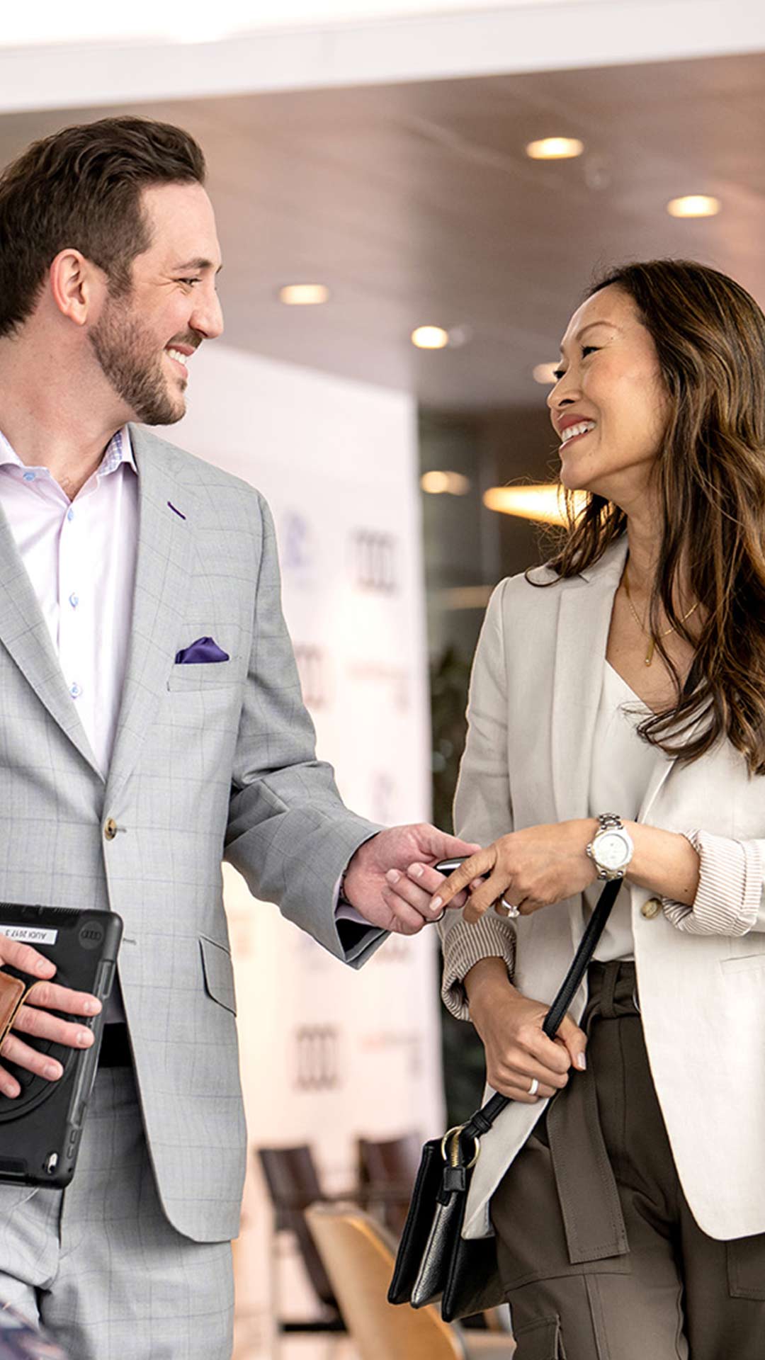 Audi salesman shaking hands with customer.
