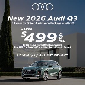 Side view of an Audi Q3 parked.