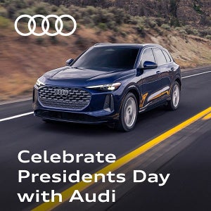 View of the driver's side of the Audi Q5 driving