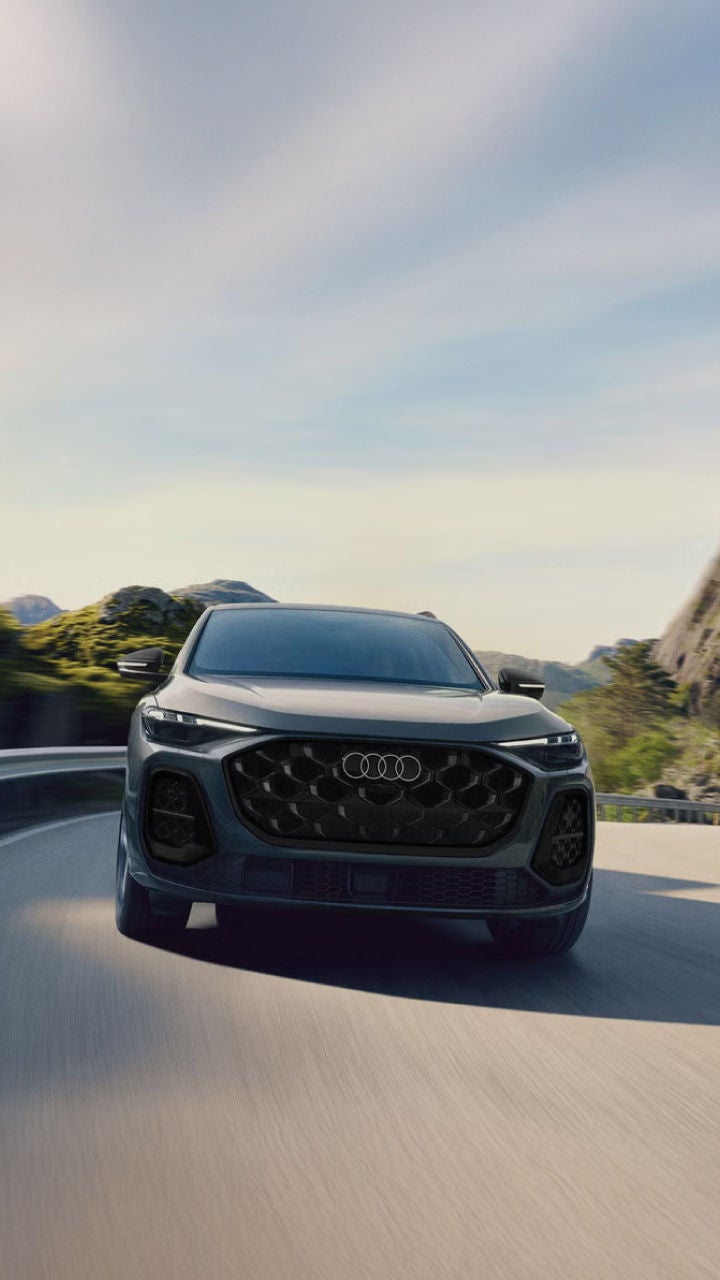 Right side profile of an Audi SQ5 parked.