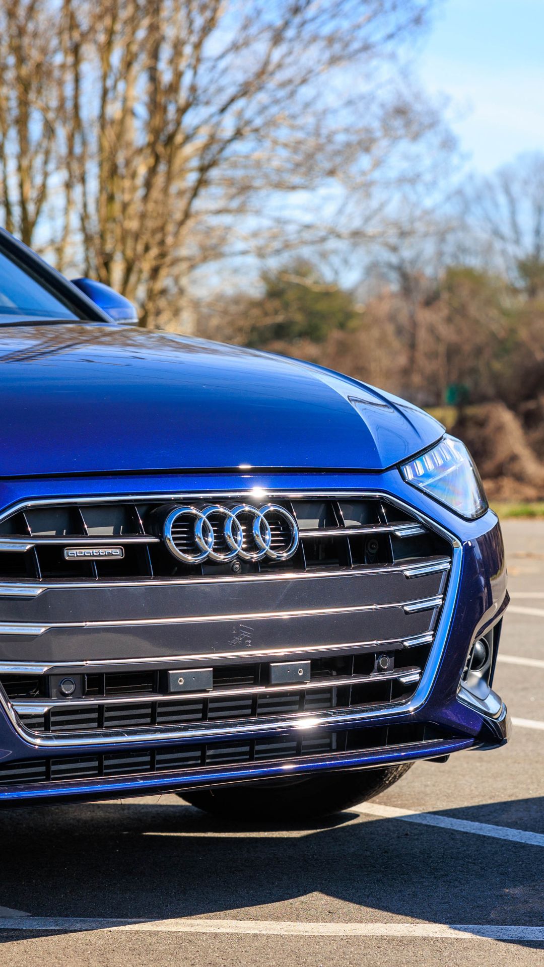Three quarter view of an Audi parked.