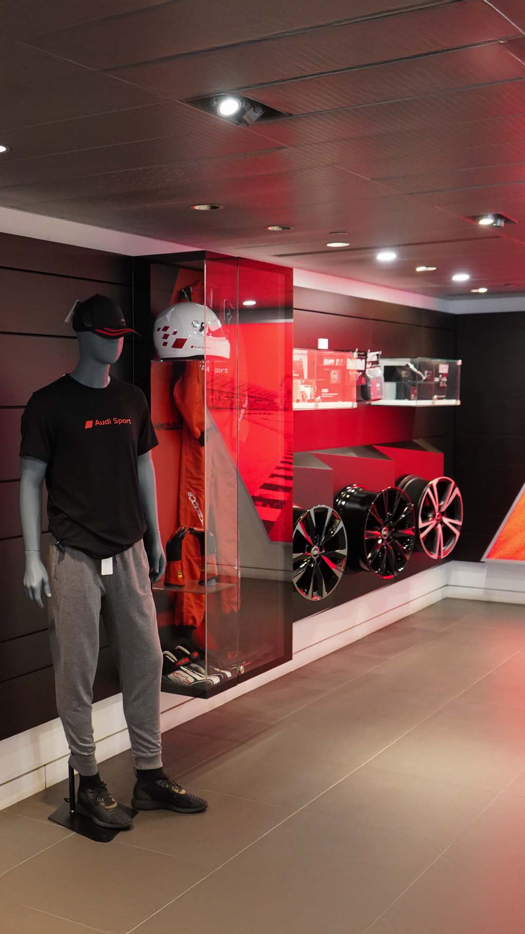 Audi service technician servicing a vehicle.