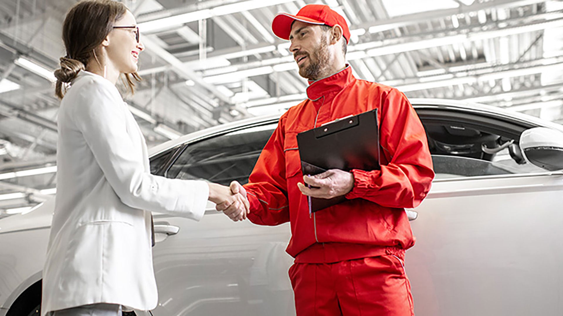 Audi Service Technician shaking hands with customer. 