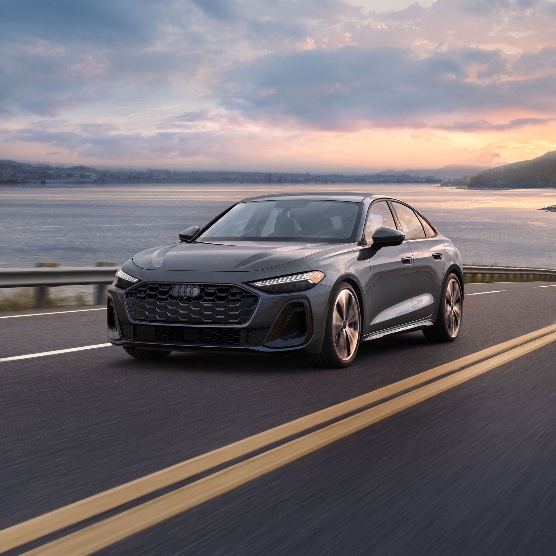 Three-quarter front-view of the all-new Audi A5 accelerating.