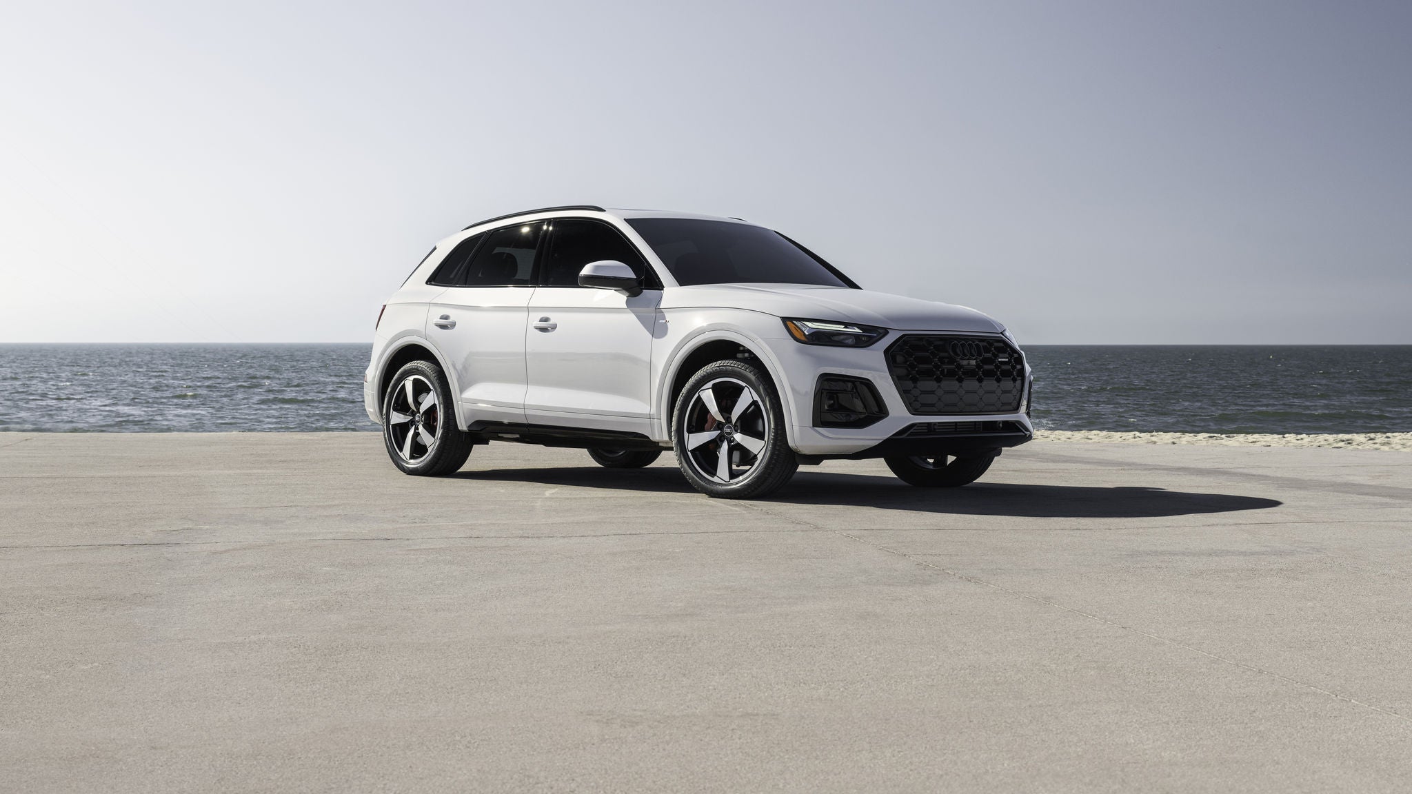 Left profile view of an Audi Q5 driving.
