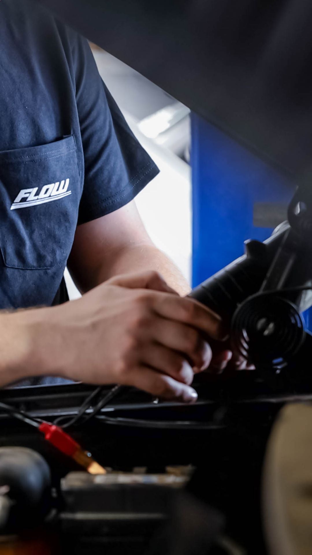 Audi service technician servicing a vehicle.