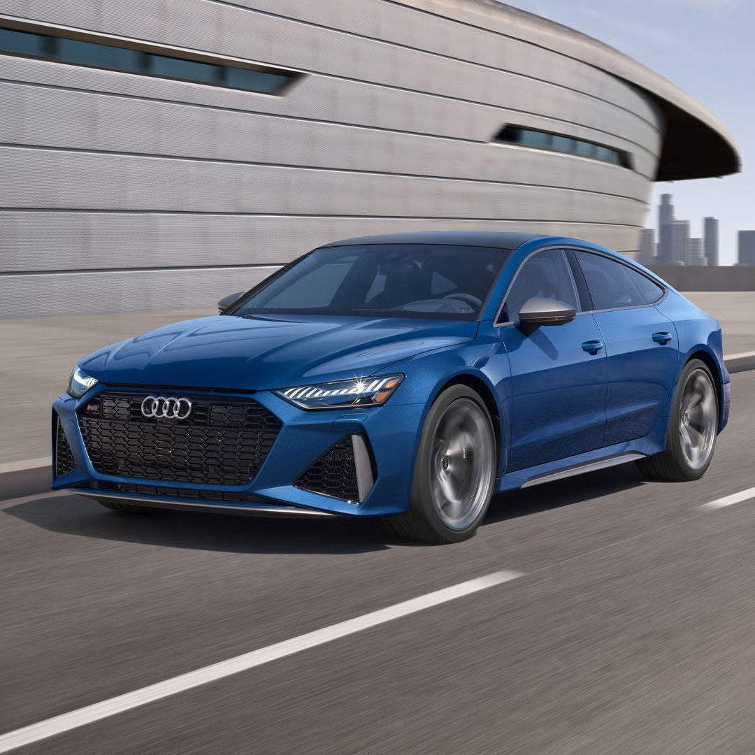 Three-quarter front view of the Audi RS 7 accelerating.