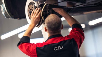 Service advisor servicing brake pad