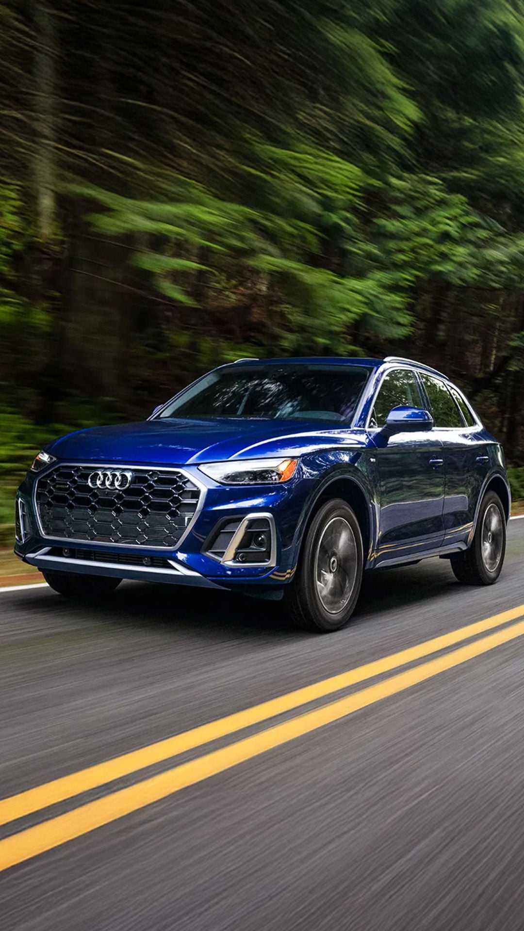 Pre-Owned Audi in motion going down the road