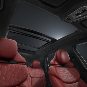 View from the passenger side into the interior of the Audi SQ7 SUV with a focus on the panoramic sliding roof.