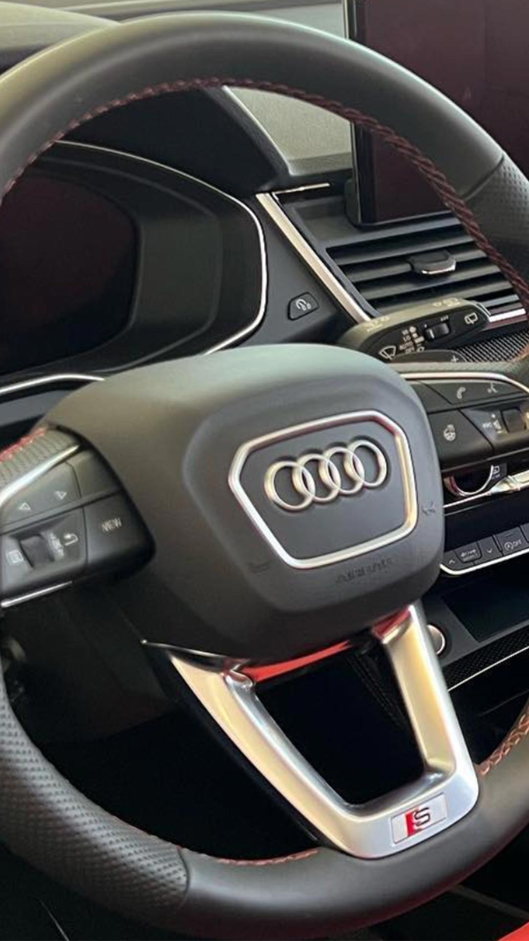 Audi Sale Specialist walking through the showroom with a couple.