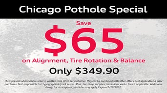 Service technician servicing vehicle. 