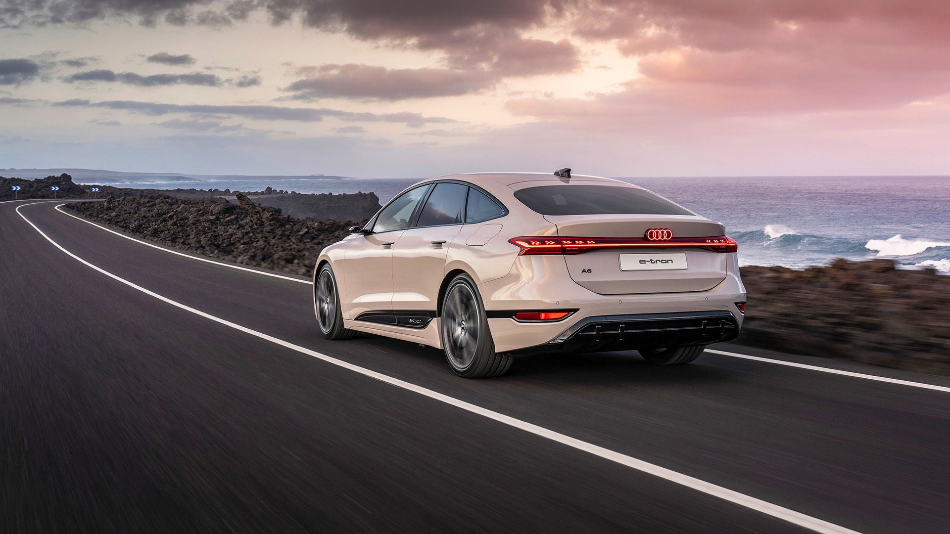 Audi A6 e-tron driving by water