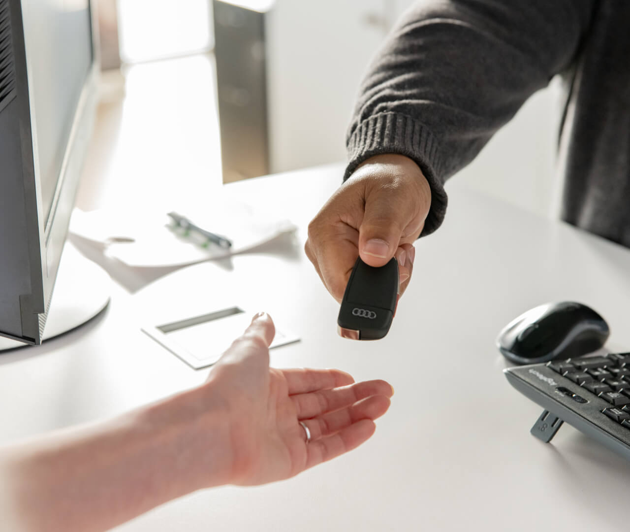 Audi Key Fob being handed over to new buyer