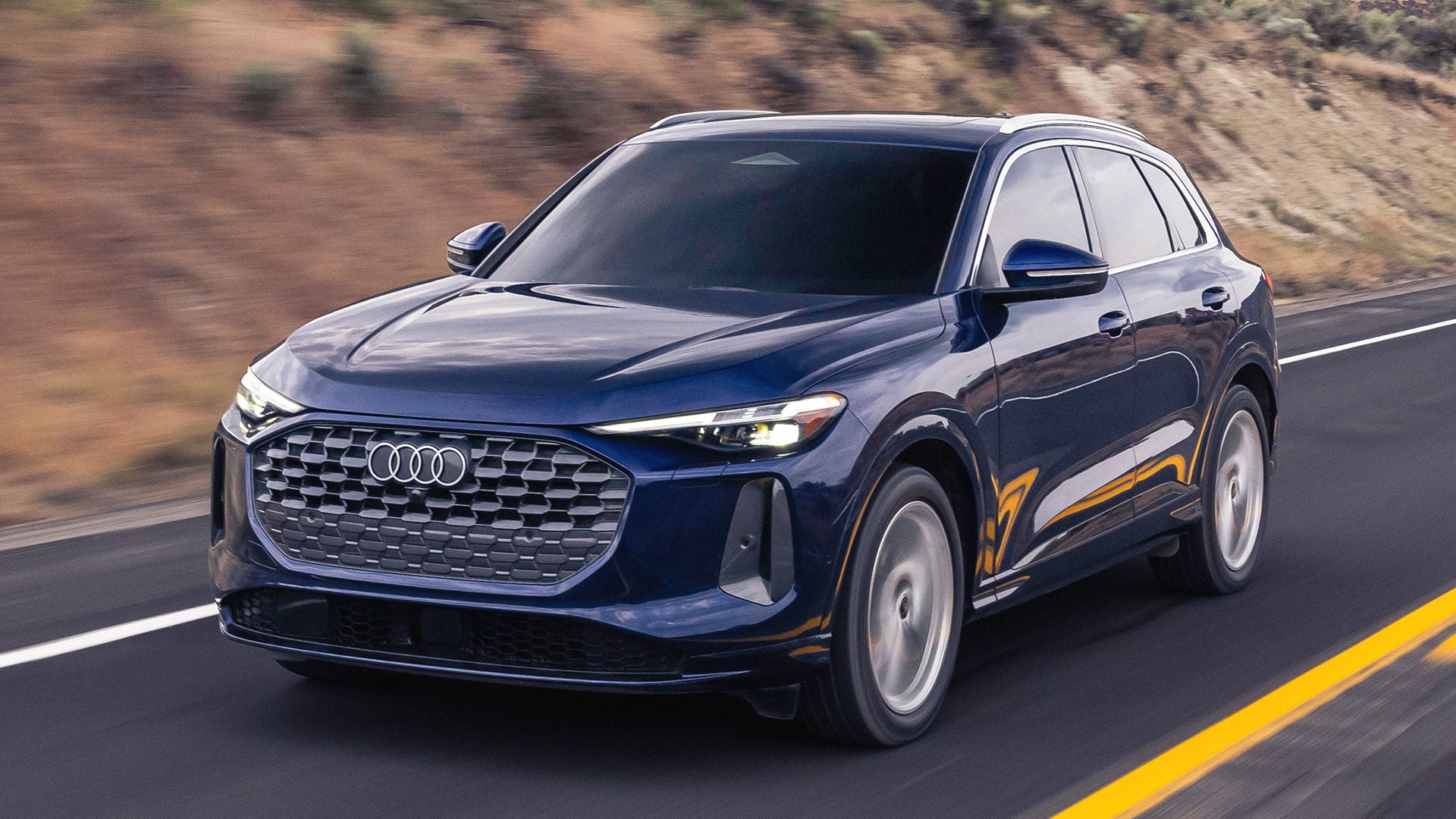 Three quarter view of an Audi Q5 accelerating.