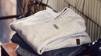 Audi quarter zip pullover neatly folded.