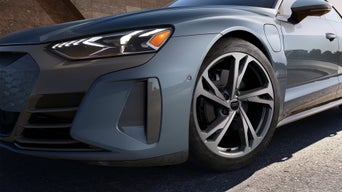Close-up of the wheel of a gray Audi e-tron GT.