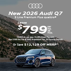 Side view of an Audi Q7 driving.
