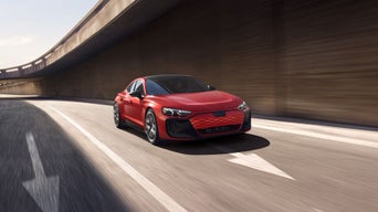 Three-quarter front view of the Audi RS e-tron GT accelerating