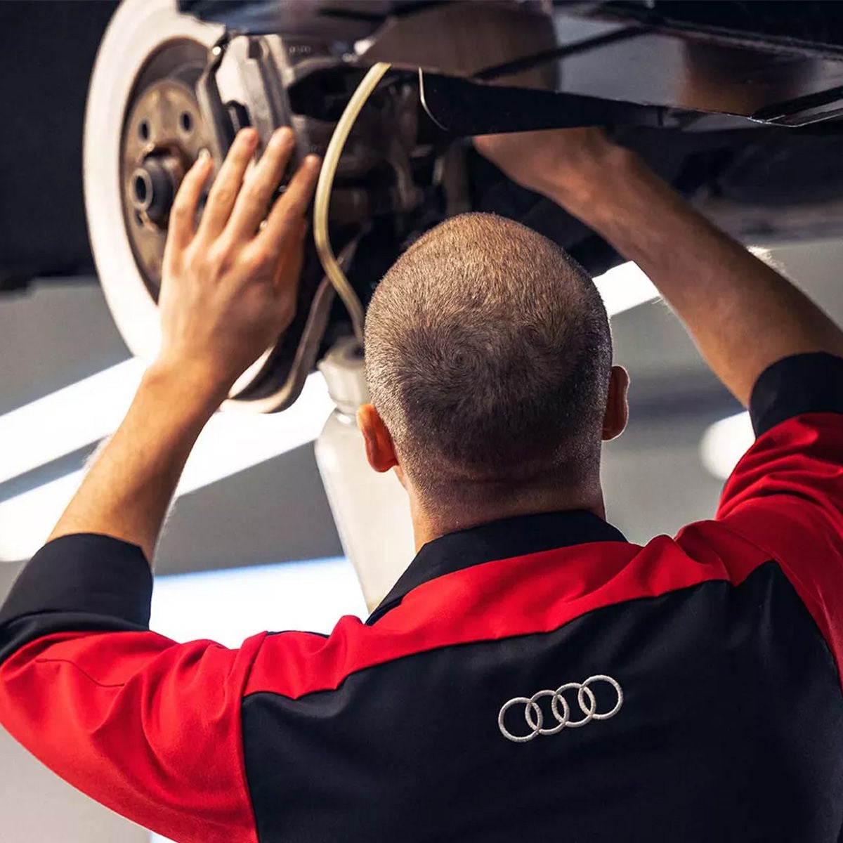 Service team member working on a vehicle