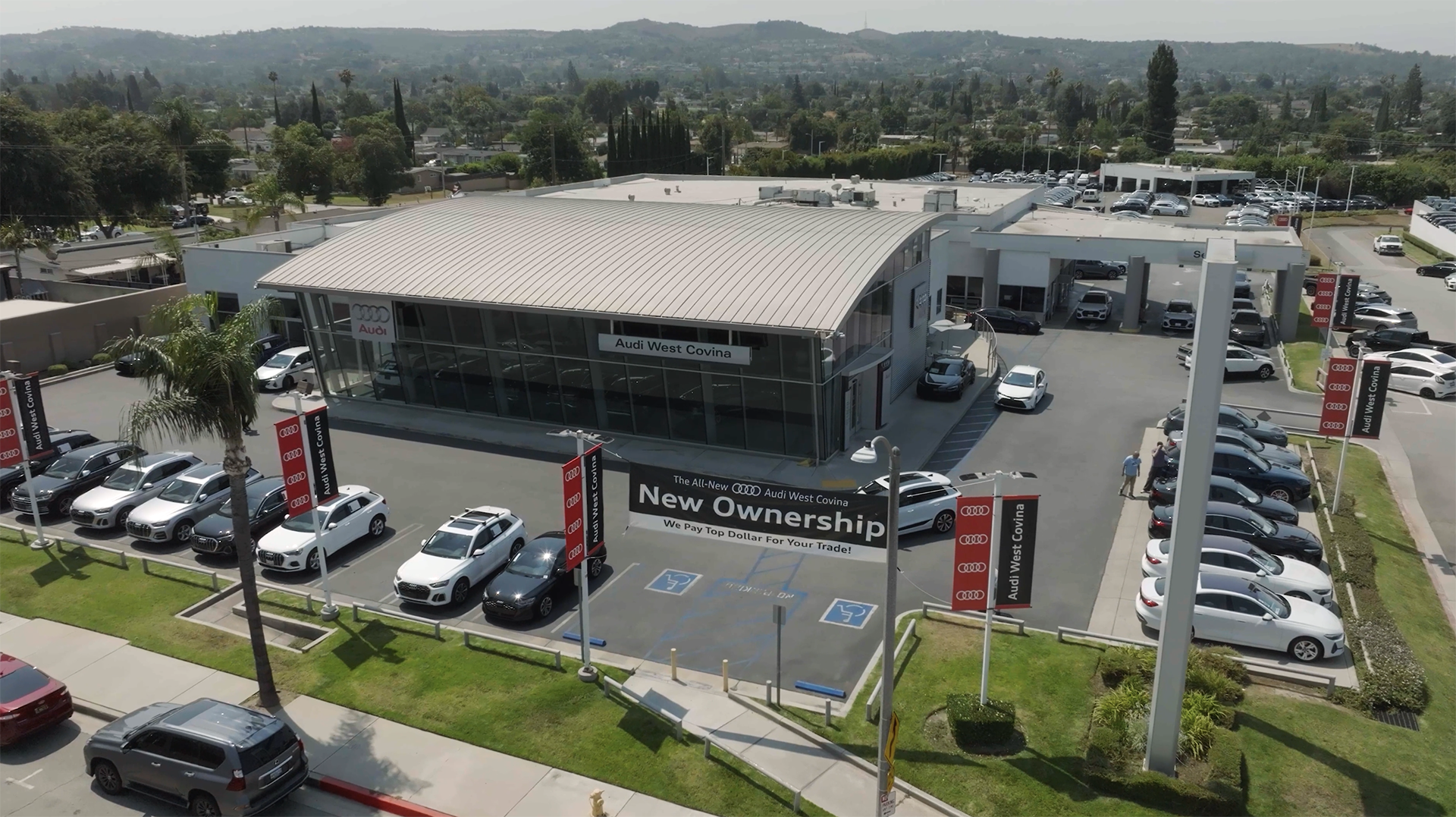 Audi 2025 Audi Q6 e-tron left profile driving.