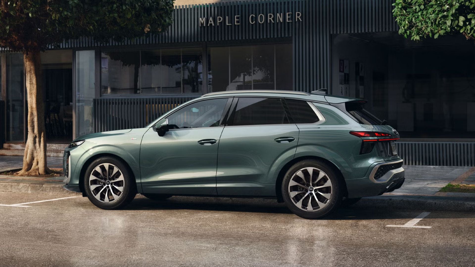 Drivers side profile view of an Audi Q3 SUV parked.