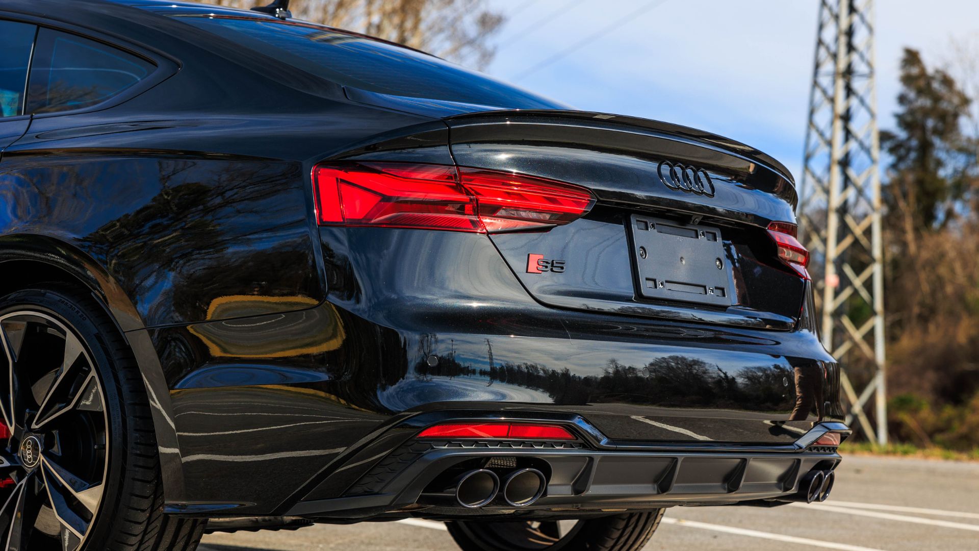 Side view of an Audi vehicle parked.