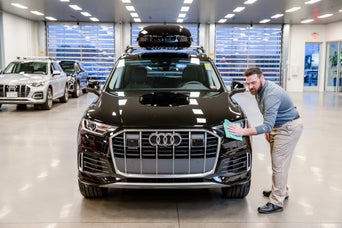 Audi technician servicing a vehicle