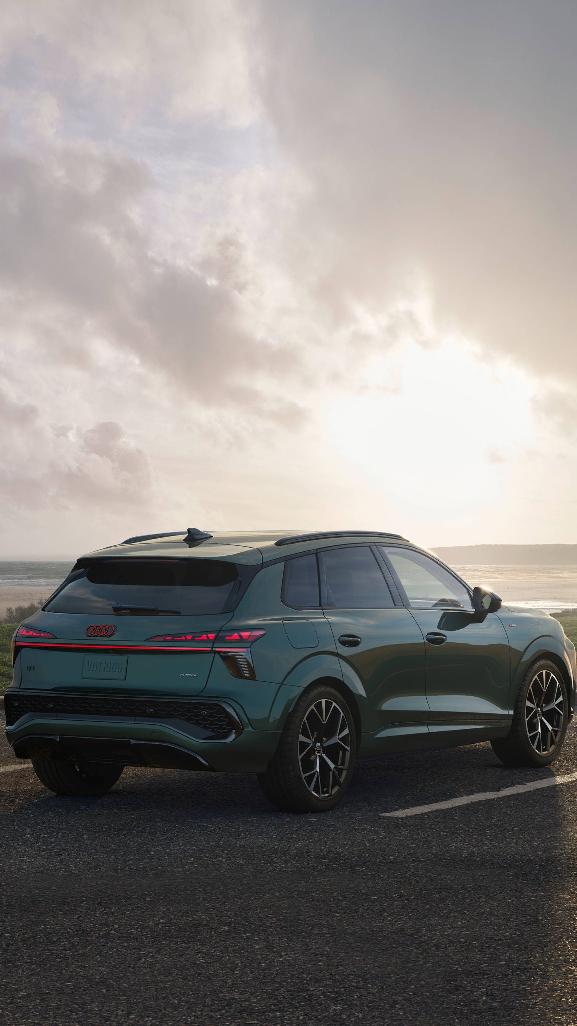 Back right profile view of the All-New Audi Q3 parked.