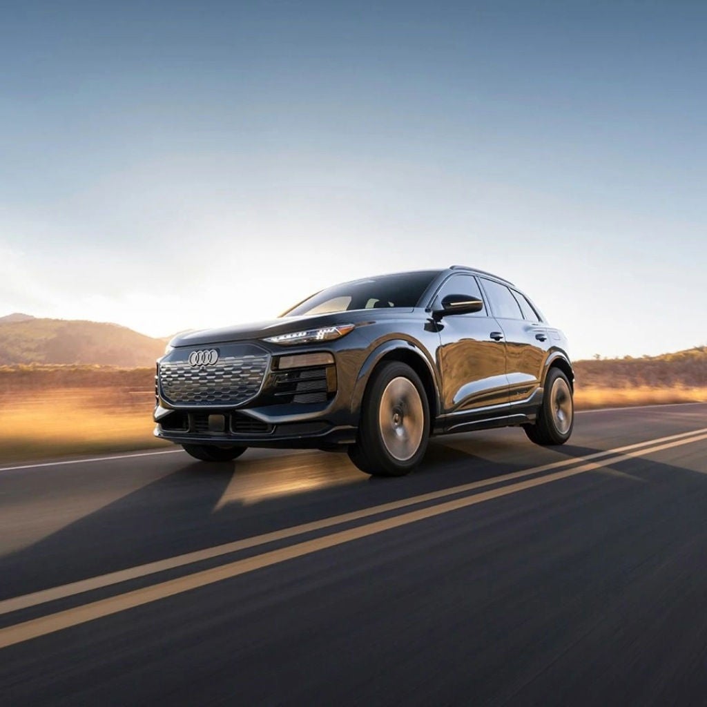 Black Audi SUV driving on the highway