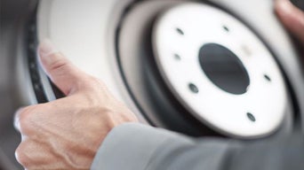 Service technician serving brakes