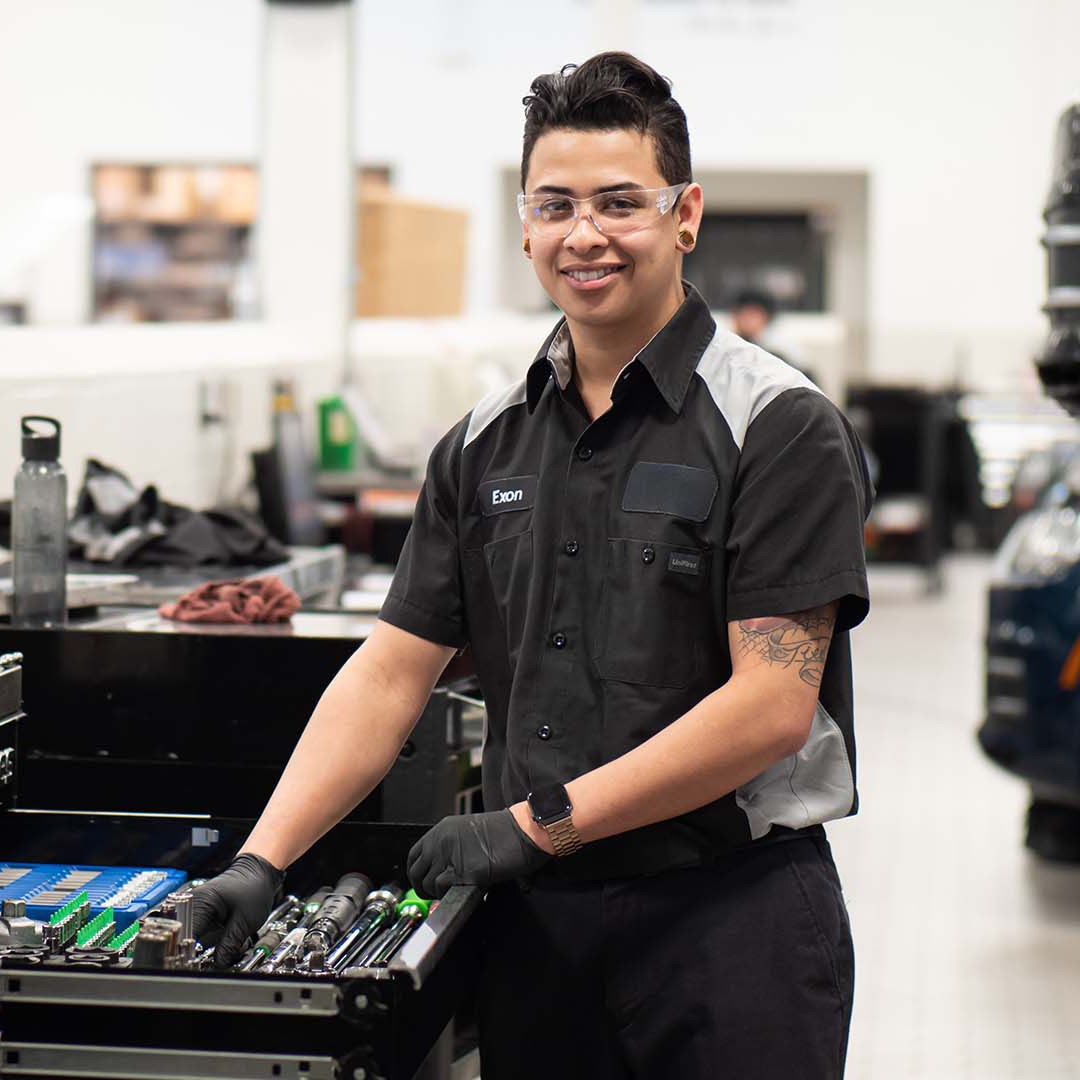 Service technician holding tools.