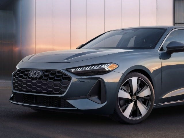 Front view of the Audi A5 featuring the signature Singleframe grille and LED headlights