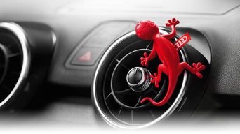 Close-up on the Audi gecko air freshener.