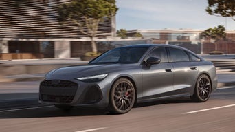 Front side view of an Audi A6 driving.