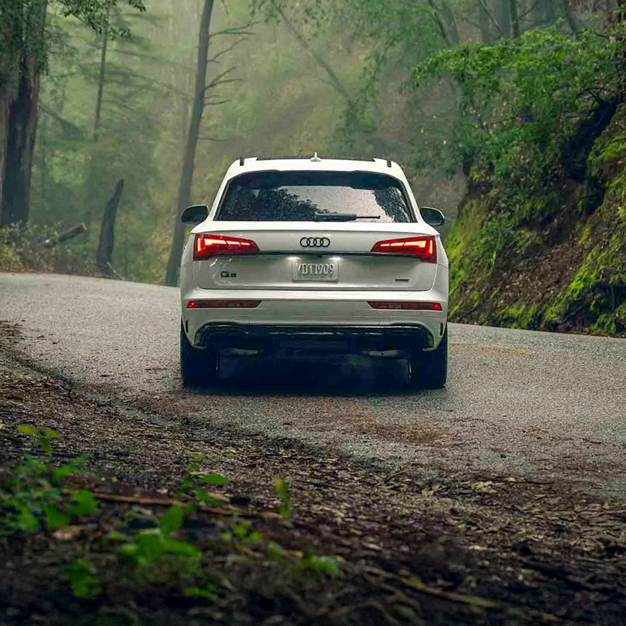 Rear profile view of an Audi Q5 parked.
